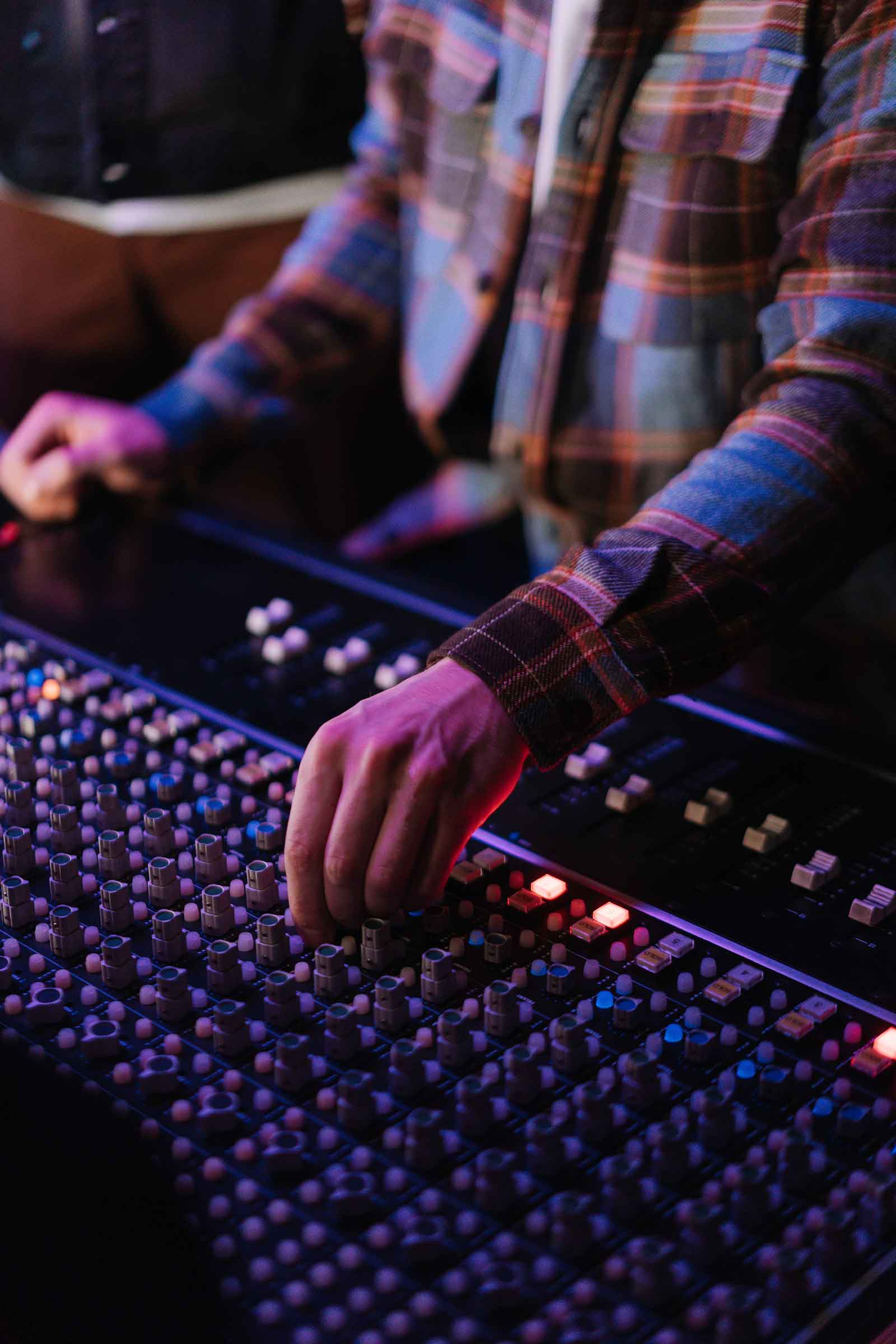 A Person using Audio Mixer